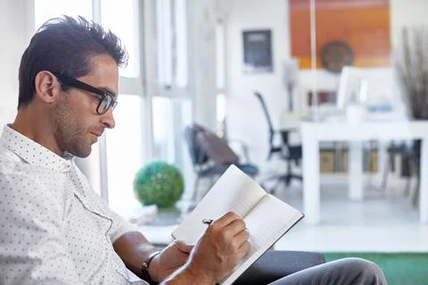 Man, writing and notebook in office for startup, schedule or review agenda .. Stock Photos