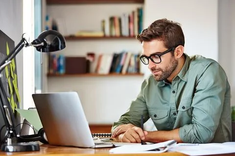 Man, writing and remote work with laptop in home office, creative or planni.. Stock Photos