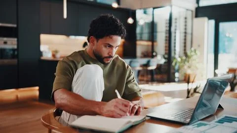 Man, writing and remote work in house with laptop, data analytics and revie.. Stock Photos