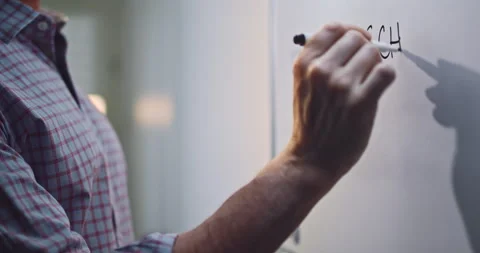 Man Writing Back to School on Whiteboard with Marker Stock Footage 343564533
