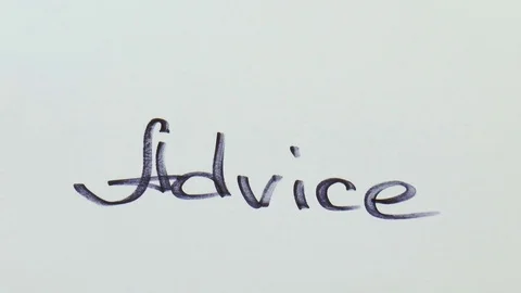Man is writing a black marker word for advice Stock Footage 79851100