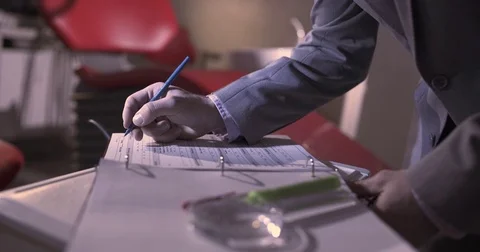 Man Writing in Book Stock Footage 71210569