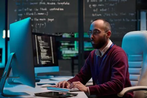 Man Writing Code in IT Department Foto stock