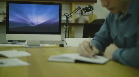 Man Writing Code For Ux on Paper. view3 Stock Footage 53111070