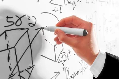 Man writing complex math formulas on whiteboard. Mathematics and science 스톡 사진