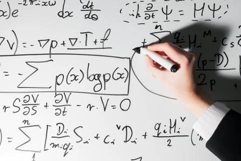 Man writing complex math formulas on whiteboard. Mathematics and science Stock Photos