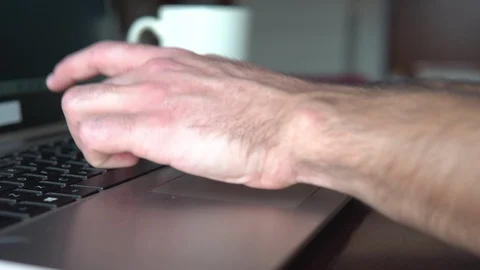 Man writing on the computer and taking notes with pen Stock Footage 129440034