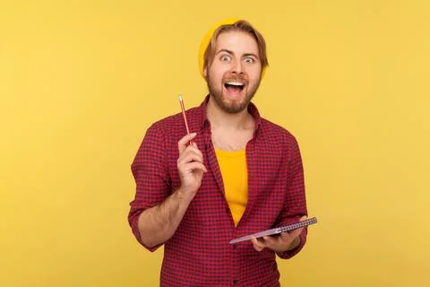 Man writing creative idea into notebook, drawing sketch or taking notes in paper Foto stock