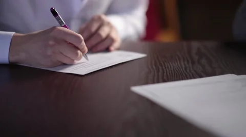 A man is writing description - medium shot Stock Footage 58395398