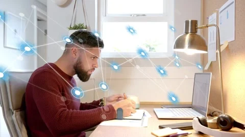 Man writing at desk, pen tapping sparking blue node network overlay, aiding tech Stock Footage 333609841