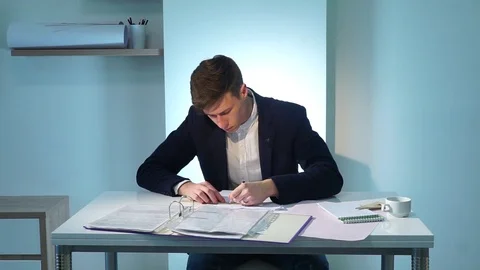 Man writing documents Stock Footage 74698804