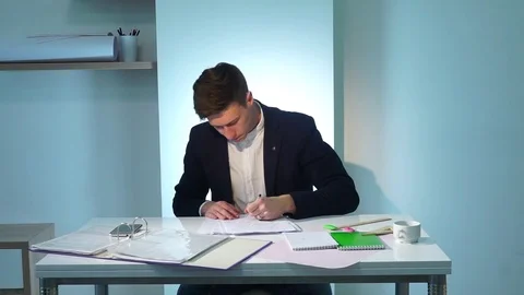 Man writing documents Stock Footage 74698841