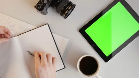 Man Writing, Drinks Coffee then Taps Green Screen Tablet in Slowmotion 動画素材 176974925