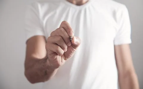 Man writing in the empty screen. Stock Photos