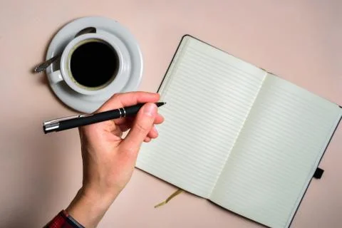 Man writing by left hand Stock Photos