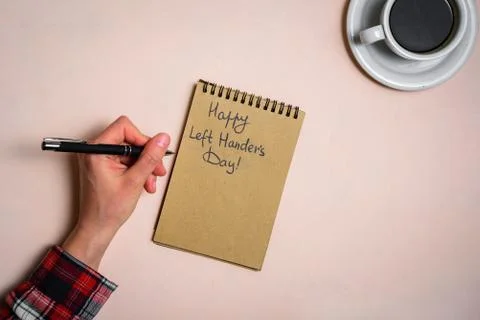 Man writing by left hand Stock Photos