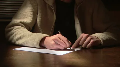 Man writing letter Stock Footage