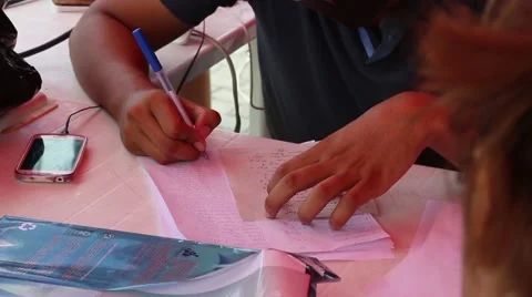 Man writing logs for the emergency services in Ecuador after 2016 quake Stock Footage 62830550