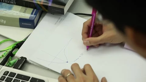 The man is writing Mathematical equation on papper Stock Footage 54025945