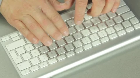 Man writing with a modern keyboard Stock Footage 54582480