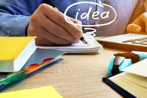 Man writing in the note. Creative idea concept. Stock Photos