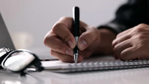 Man writing on a notebook, E-learning online study concept Stock Footage 161614888