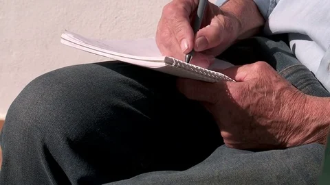 Man writing in notebook Stock-Footage 73349202