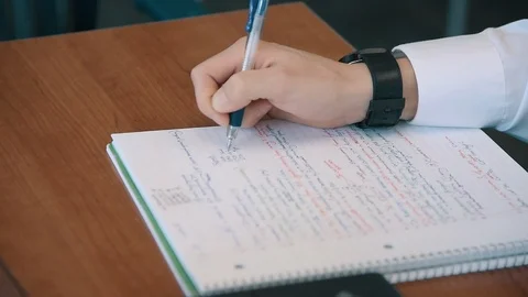 Man Writing in Notebook Stock Footage 86881181