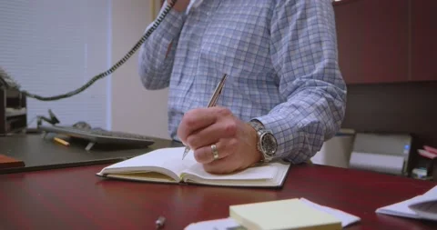 Man Writing in Notebook Stock Footage 200790395