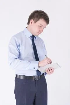 Man writing in a notebook Stock Photos