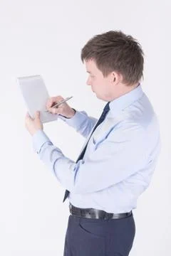 Man writing in a notebook Stock Photos