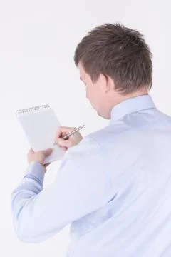 Man writing in a notebook Stock Photos