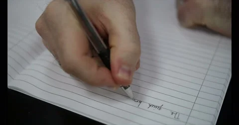 Man writing in a Notebook using a Pen on Paper Stock Footage 51279246