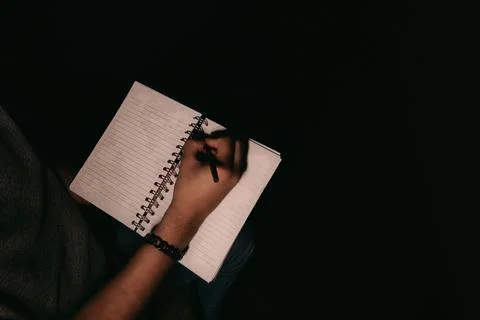 Man writing on notepad with copyspace Stock Photos