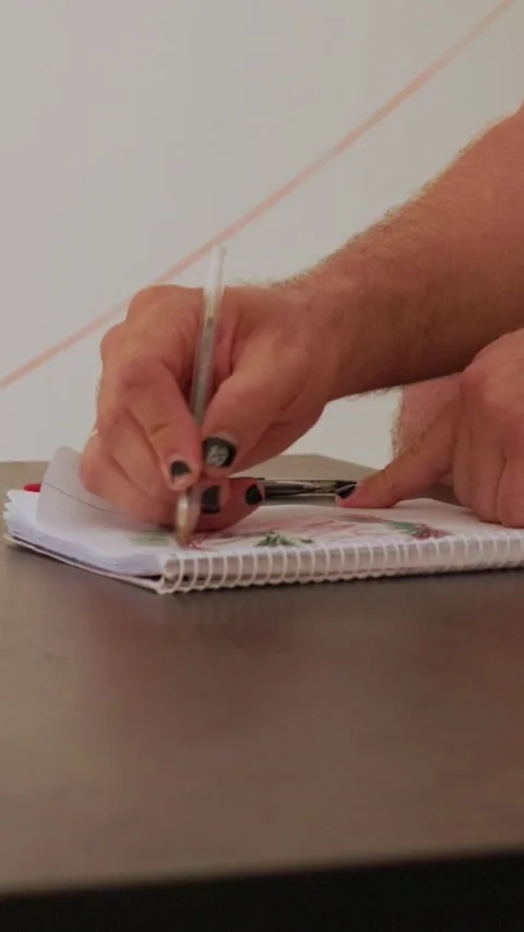 Man writing on a notepad Stock Footage 327862507