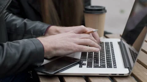 Man writing notes and working in cafe shop Stock Footage 237930994