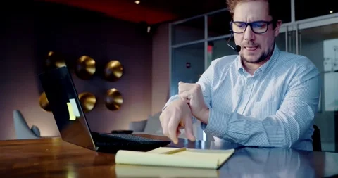 Man Writing Notes During Online Meeting in Office Stock Footage 323680796