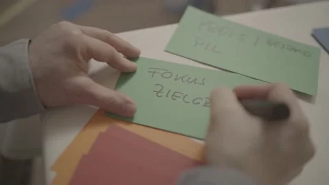 Man writing on a paper Stock Footage 149242544