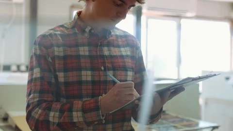 Man writing with pen in tablet at work.. Closeup of business man hand write Stock Footage 110793848