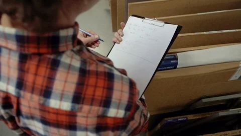 Man writing with pen in tablet at work.. Closeup of business man hand write Stock Footage 110798798