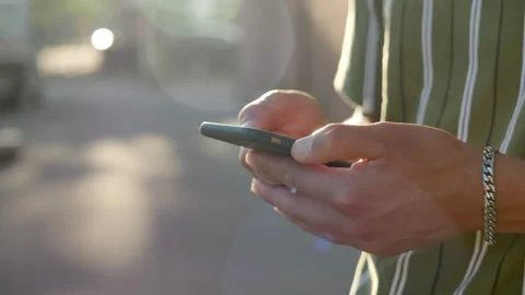 Man writing on the phone slow motion iPhone texting close Stock Footage 296386907