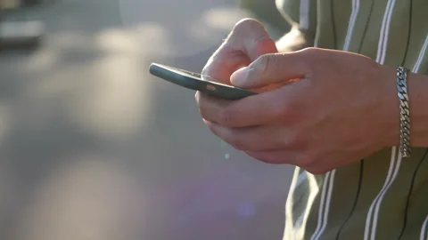 Man writing on the phone slow motion iPhone texting close Stock Footage 296398123