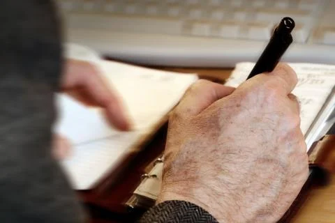 Man writing Stock Photos