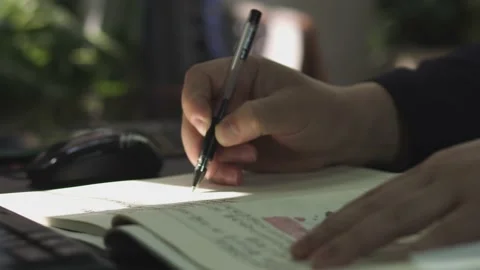 A Man Writing A Proposal With A Pen Stock Footage 168505892