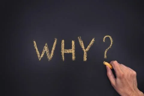 Man writing question Why on chalkboard Stock Photos