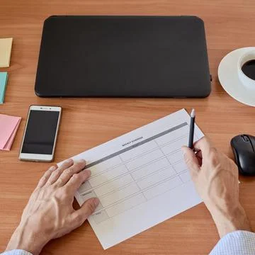 Man writing reminder Stock Photos