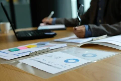 Man writing reminder schedule note on notebook. businessman working organizin Stock Photos