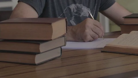 Man Writing On The Table Stock Footage 117965126