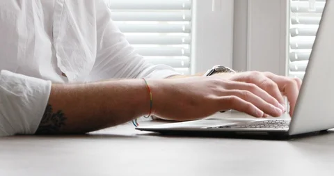 Man writing then smiling to camera - closeup Stock Footage 89674564