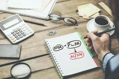 Man written action text  on notepad Stock Photos